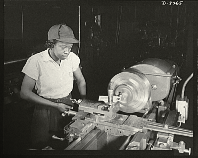 Juanita E. Gray at work at Washington Navy Yard, circa 1942. Black women and men in Northern Virginia found jobs in the District of Columbia, increasingly during World War II. At the time of the photo, more than 300 black women had been trained by the National Youth Administration War Production and Training Center. Source: Library of Congress.