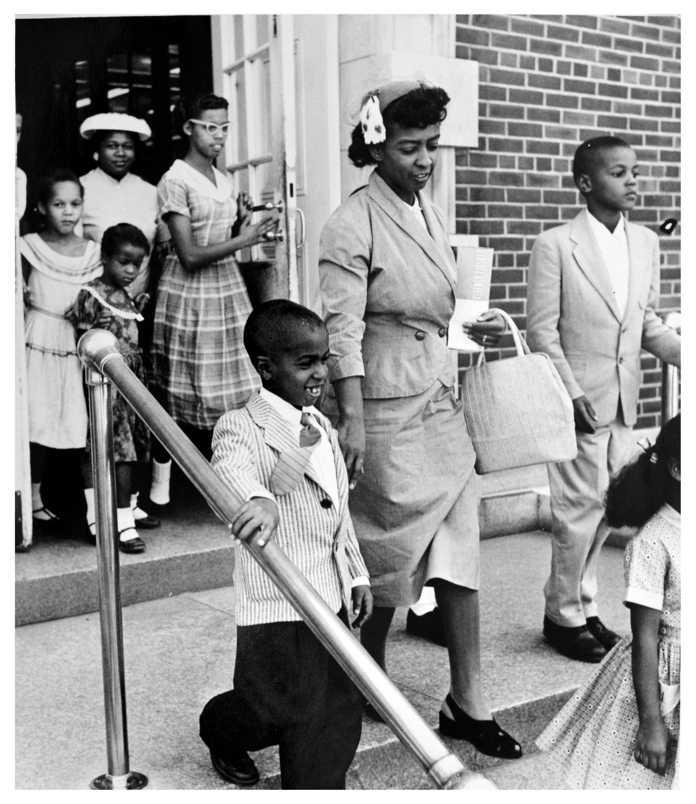 Black children and their parents leave the Alexandria courthouse on September 8, 1958 after being denied an injunction to end segregation of the city’s schools. At the time, Virginia state law required the closure of any public school system that admitted Black students to white schools, as part of Virginia’s “massive resistance” to the Brown v. Board of Education decision. Source: DC Public Library, Star Collection © Washington Post.
