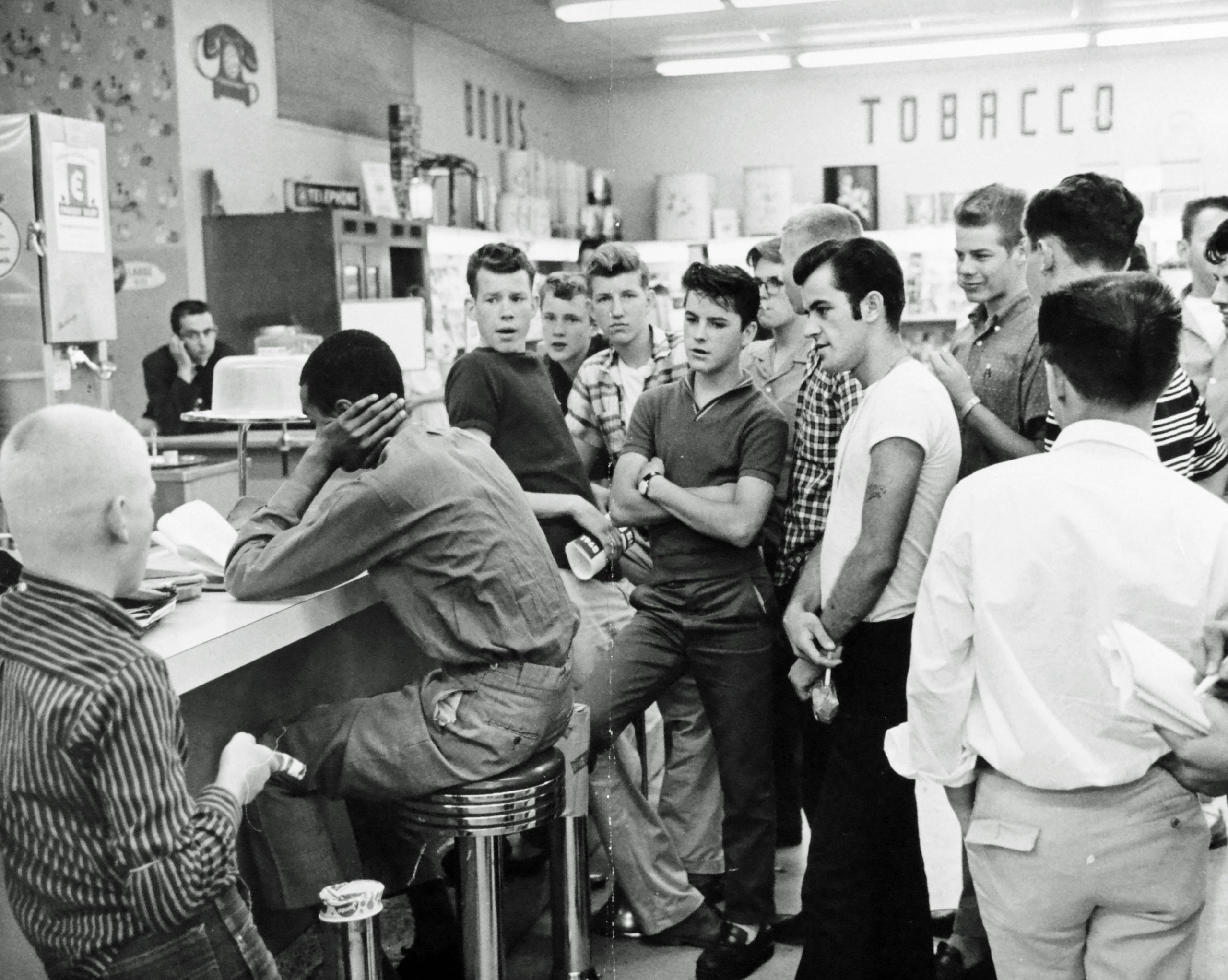 Civil rights activist Dion Diamond is confronted at a sit-in at the Cherrydale Drug Fair in Arlington, June 10, 1960. 
DC Public Library, Star Collection © Washington Post.