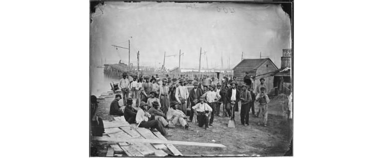 Black laborers at the coalyard wharf in Alexandria, during the Civil War. The port was a major shipping center for the coal industry and an employer of Black workers. Source: National Archives.