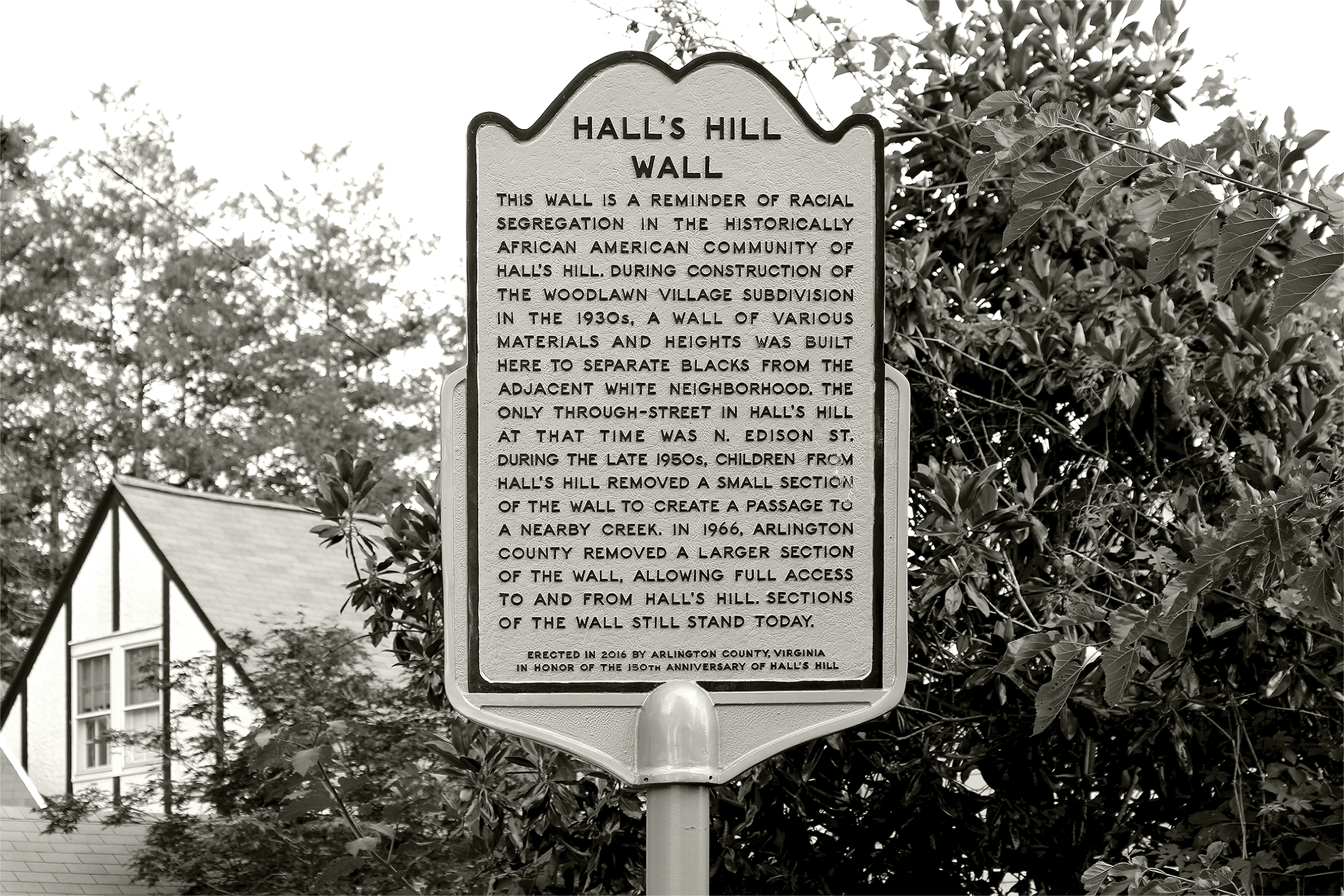At the intersection of North Culpeper Street and 17th Street North in Arlington, remnants of a wall that once extended from North Edison Street to North Glebe Road. The wall was constructed in the 1930s to physically separate the white neighborhood of Woodlawn (now Waycroft-Woodlawn) from the historically Black neighborhood of Hall’s Hill. Photo by Carol Woolf.