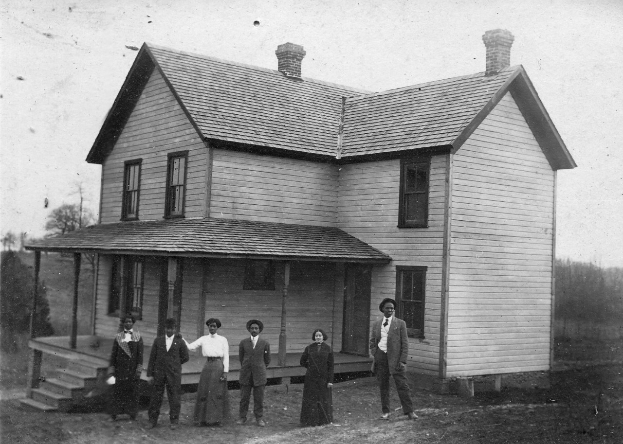 Tinner family at their home in the late 1800s. Joseph and Mary Tinner bought land in Falls Church. In the early 1900s, Joseph Tinner and E.B. Henderson fought local segregation laws and founded the first rural branch of the NAACP in the United States. Tinner served as president. The construction of Lee Highway was routed through this enclave in the 1920’s. Source: Tinner Hill Heritage Foundation.
