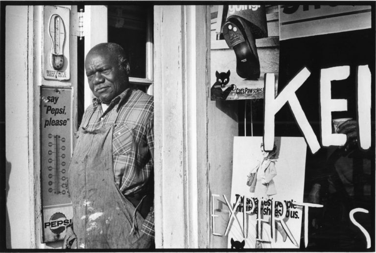 Richard Walker at his Green Valley/Nauck business, the only shoe repair shop in Arlington that served Black customers. Arlington, 1980. Photo by Lloyd Wolf.